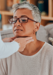 Dysphagia Screening for Adults | Jubilee Speech Therapy | Baldwin County, Alabama Speech-language pathologist checks an adult client’s throat and jaw during a swallowing evaluation (dysphagia screening) at Jubilee Speech Therapy in Daphne, Alabama.