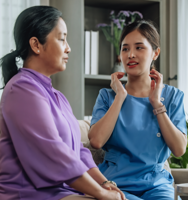 Adult Voice Therapy Session | Jubilee Speech Therapy | Baldwin County, Alabama Speech therapist demonstrates voice and throat exercises with an adult client during a speech therapy session at Jubilee Speech Therapy in Baldwin County, Alabama.